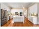Updated kitchen with stainless steel appliances, a center island and ample cabinet space at 3786 Turnberry Ct, Duluth, GA 30096