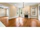 Bright living room with hardwood floors, fireplace, and large windows at 3786 Turnberry Ct, Duluth, GA 30096
