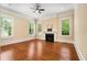 Bright living room with hardwood floors, fireplace, and large windows at 3786 Turnberry Ct, Duluth, GA 30096