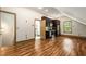 Open concept features hardwood floors, kitchen and stainless steel appliances, and half bath at 3786 Turnberry Ct, Duluth, GA 30096