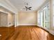 Open living room with hardwood floors and bright natural light at 3786 Turnberry Ct, Duluth, GA 30096