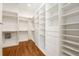 Spacious walk-in closet featuring custom shelving at 3786 Turnberry Ct, Duluth, GA 30096