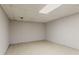 A spacious unfinished basement with tile floors and ample lighting at 5073 Leland Dr, Stone Mountain, GA 30083