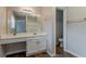 Bathroom with white vanity, large mirror and tiled floors at 5073 Leland Dr, Stone Mountain, GA 30083