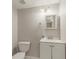 A clean bathroom with a vanity, mirror, and toilet at 5073 Leland Dr, Stone Mountain, GA 30083