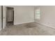 A modest bedroom with neutral walls and carpet flooring at 5073 Leland Dr, Stone Mountain, GA 30083