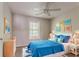 Bright bedroom styled with blue accents, white furniture, and natural light at 5073 Leland Dr, Stone Mountain, GA 30083