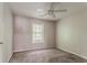 Bedroom featuring neutral walls, plush carpet and a bright window at 5073 Leland Dr, Stone Mountain, GA 30083