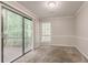 Bedroom with a sliding glass door leading to a deck, neutral paint, and carpet at 5073 Leland Dr, Stone Mountain, GA 30083