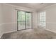 Bedroom with a sliding glass door leading to a deck and a window at 5073 Leland Dr, Stone Mountain, GA 30083