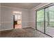 Open dining area with sliding glass doors to a deck and view to kitchen at 5073 Leland Dr, Stone Mountain, GA 30083