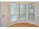 Dining area featuring three windows, neutral paint, and vinyl floors at 5073 Leland Dr, Stone Mountain, GA 30083