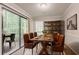 Dining room with a table, seating for six, sliding glass door, and a shelving unit at 5073 Leland Dr, Stone Mountain, GA 30083
