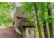 Home exterior featuring a deck and hillside setting at 5073 Leland Dr, Stone Mountain, GA 30083