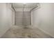 An empty single-car garage with white walls and a gray door at 5073 Leland Dr, Stone Mountain, GA 30083