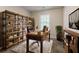 Office with a large bookcase, industrial style desk, and natural light at 5073 Leland Dr, Stone Mountain, GA 30083