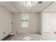 Unfinished bonus room with natural light and entry doors, perfect for customization at 5073 Leland Dr, Stone Mountain, GA 30083