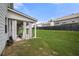 Lush backyard with a covered patio and privacy fence to enhance outdoor living at 7644 Rudder Cir, Fairburn, GA 30213