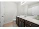 Bathroom features a spacious countertop with dark cabinets, a sink, and a tile floor at 7644 Rudder Cir, Fairburn, GA 30213