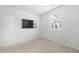 Bright bedroom with a TV and a window with blinds at 7644 Rudder Cir, Fairburn, GA 30213