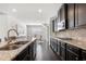 Modern kitchen with a center island, stainless steel appliances, and plenty of countertop space at 7644 Rudder Cir, Fairburn, GA 30213
