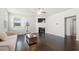 Bright living room with hardwood floors, fireplace, and modern furnishings at 7644 Rudder Cir, Fairburn, GA 30213
