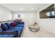 Comfortable living room with blue sofa and modern decor at 7644 Rudder Cir, Fairburn, GA 30213
