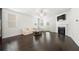 Bright living room with a fireplace, hardwood floors, and a walkout patio at 7644 Rudder Cir, Fairburn, GA 30213
