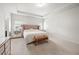 Main bedroom with decorative lamps, mirrored nightstands and upholstered headboard at 7644 Rudder Cir, Fairburn, GA 30213