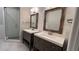Modern bathroom featuring double vanity, tile flooring, and glass-enclosed shower at 793 Inman Mews Ne Dr, Atlanta, GA 30307