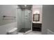 Modern bathroom with glass-enclosed shower, gray tile flooring, and vanity at 793 Inman Mews Ne Dr, Atlanta, GA 30307
