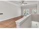 Cozy room featuring wood floors, ceiling fan, and natural light at 793 Inman Mews Ne Dr, Atlanta, GA 30307