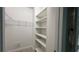 Walk-in closet with built-in shelving and ample storage space at 793 Inman Mews Ne Dr, Atlanta, GA 30307