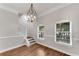 Dining area with modern chandelier and large windows at 793 Inman Mews Ne Dr, Atlanta, GA 30307
