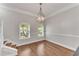 Formal dining area with elegant chandelier and natural lighting at 793 Inman Mews Ne Dr, Atlanta, GA 30307