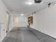 Spacious attached garage with neutral paint, offering parking space and storage at 793 Inman Mews Ne Dr, Atlanta, GA 30307