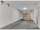 Attached garage featuring neutral paint and a roll-up door at 793 Inman Mews Ne Dr, Atlanta, GA 30307