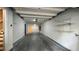Spacious garage with new epoxy flooring, shelving, and new paint at 793 Inman Mews Ne Dr, Atlanta, GA 30307