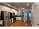 Modern kitchen with stainless steel appliances, sleek countertops, and hardwood floors at 793 Inman Mews Ne Dr, Atlanta, GA 30307