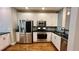 Well-equipped kitchen with stainless steel appliances, white cabinets, and stylish backsplash at 793 Inman Mews Ne Dr, Atlanta, GA 30307