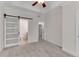 Spacious main bedroom featuring neutral color palette and a frosted sliding barn door to the ensuite at 793 Inman Mews Ne Dr, Atlanta, GA 30307
