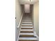 Staircase with wood treads and white risers at 793 Inman Mews Ne Dr, Atlanta, GA 30307