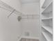 A walk-in closet features wire and solid shelving, carpet, and ample storage space at 793 Inman Mews Ne Dr, Atlanta, GA 30307
