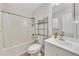 Bright bathroom featuring a shower and tub combination, updated fixtures, and a neutral color palette at 15 Echota Ne Rd, Cartersville, GA 30121
