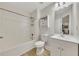 Clean bathroom with white fixtures, a shower-tub combo, and contemporary vanity at 15 Echota Ne Rd, Cartersville, GA 30121