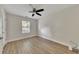 Spare bedroom showing wood floors, a ceiling fan, and a window allowing natural light at 15 Echota Ne Rd, Cartersville, GA 30121