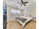 Comfortable bedroom featuring hardwood floors, a ceiling fan, and ample natural light at 15 Echota Ne Rd, Cartersville, GA 30121