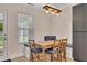 Charming dining area with a wooden table set, window view, and custom bench seating at 15 Echota Ne Rd, Cartersville, GA 30121