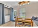 Cozy dining area combined with laundry space, illuminated by an industrial-style chandelier at 15 Echota Ne Rd, Cartersville, GA 30121