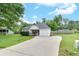 Single-story house with a green lawn and driveway leading to an attached one-car garage at 15 Echota Ne Rd, Cartersville, GA 30121